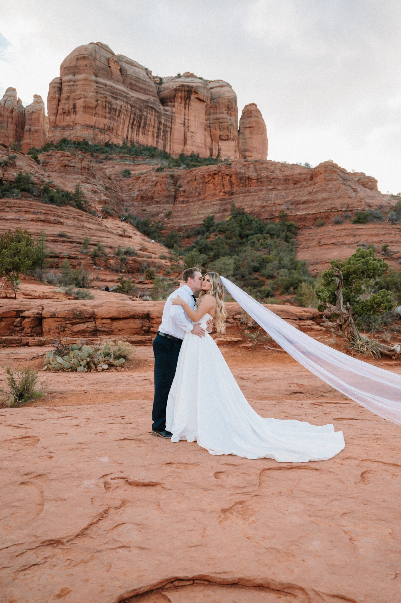 Couple standing on Cathedral Rock during a Sedona elopement
