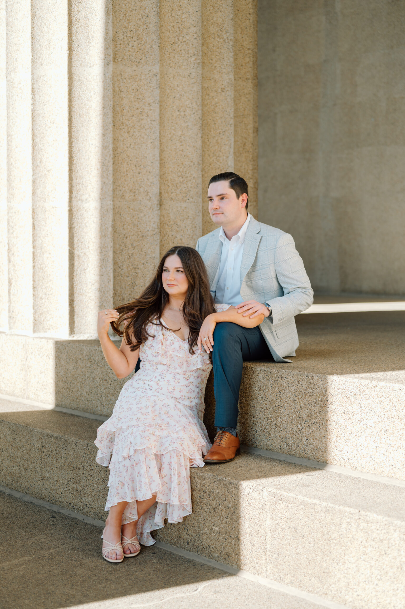 Couple sitting on the steps of the Parthenon in Nashville, Tennessee