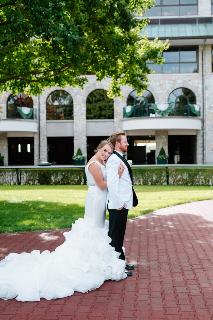Bride and groom portraits at Keeneland horse farm Lexington KY during golden hour, highlighting outdoor wedding venue in Lexington KY atmosphere.