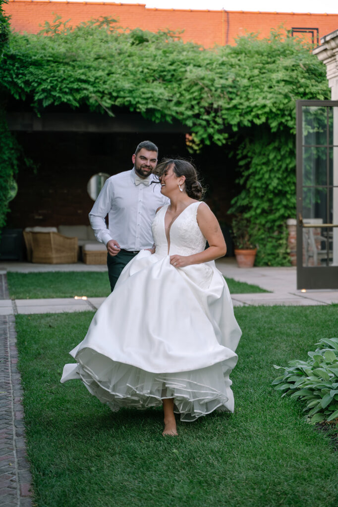 Candid laughter between bride and groom during The Apiary Lexington wedding garden portraits. 