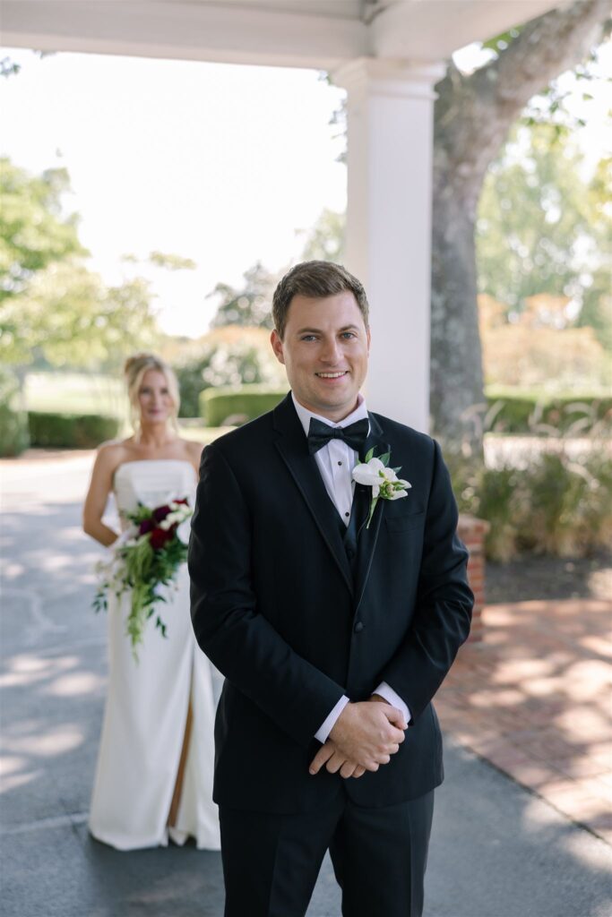 Couple sharing a quiet moment before a first look at a country club in Lexington KY wedding. 