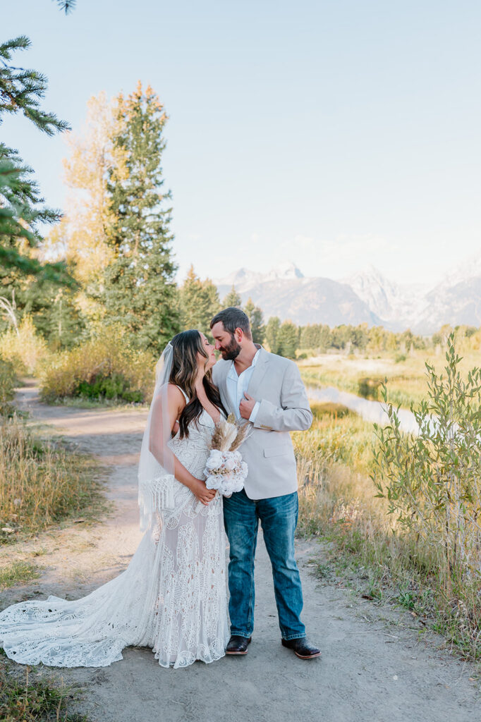 Couple eloping in Grand Teton National Park with mountain views in Wyoming.