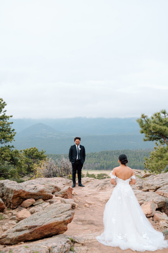 Bride and groom exploring alpine scenery in Rocky Mountain National Park.