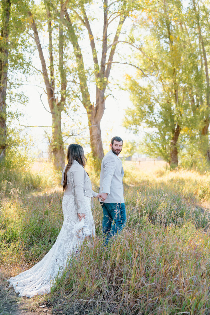 Adventurous elopement portraits near an alpine lake in Grand Teton National Park.
