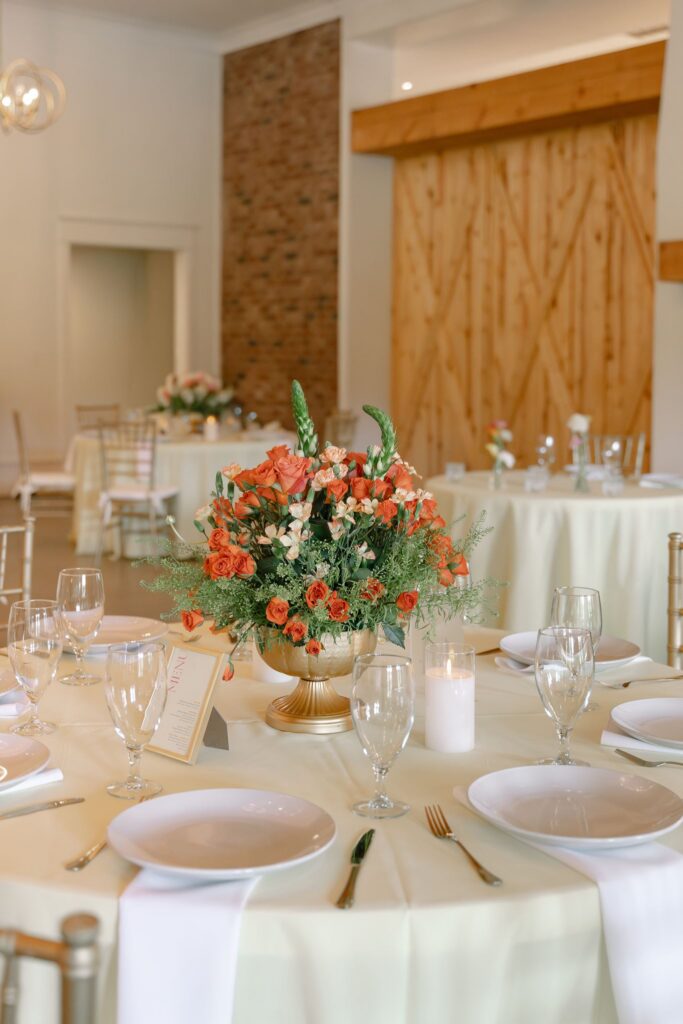 Colorful floral centerpiece and reception table design at Hazelnut Farm Events Louisville, KY. 