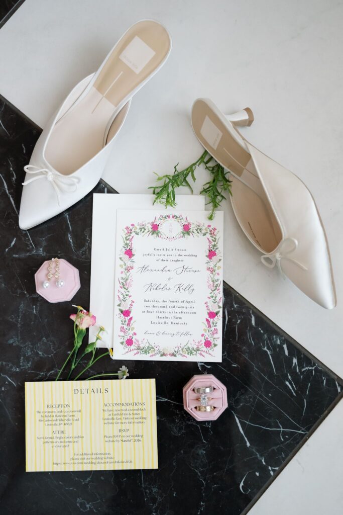 Wedding invitation suite, rings, and bridal shoes styled for a Hazelnut Farms Louisville, KY wedding