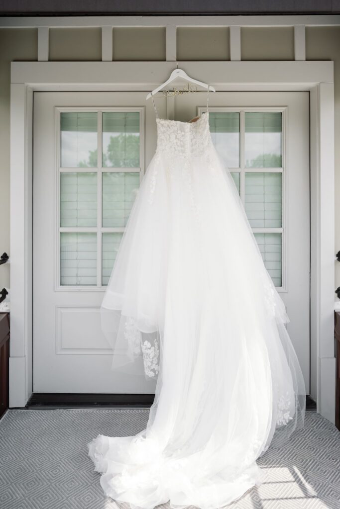 Bride's wedding dress hanging outside before a Hazelnut Farms Louisville KY Wedding. 