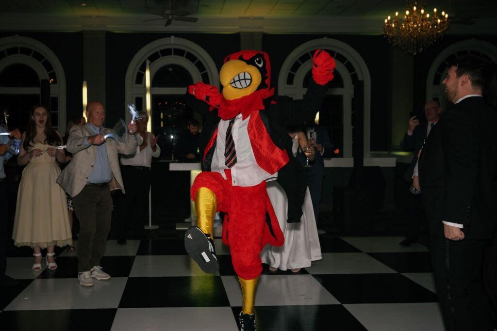 Louisville Cardinals mascot dancing during a fun reception at The Olmsted.