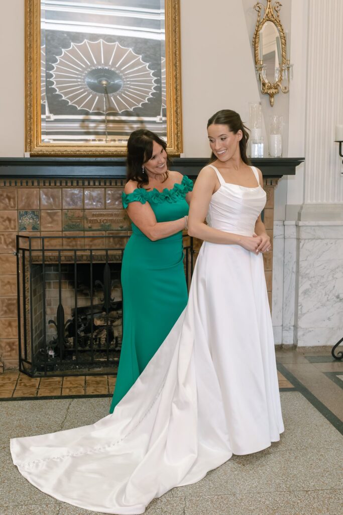 Bride sharing a sweet getting-ready moment with her mother before her The Olmsted Louisville, KY wedding.