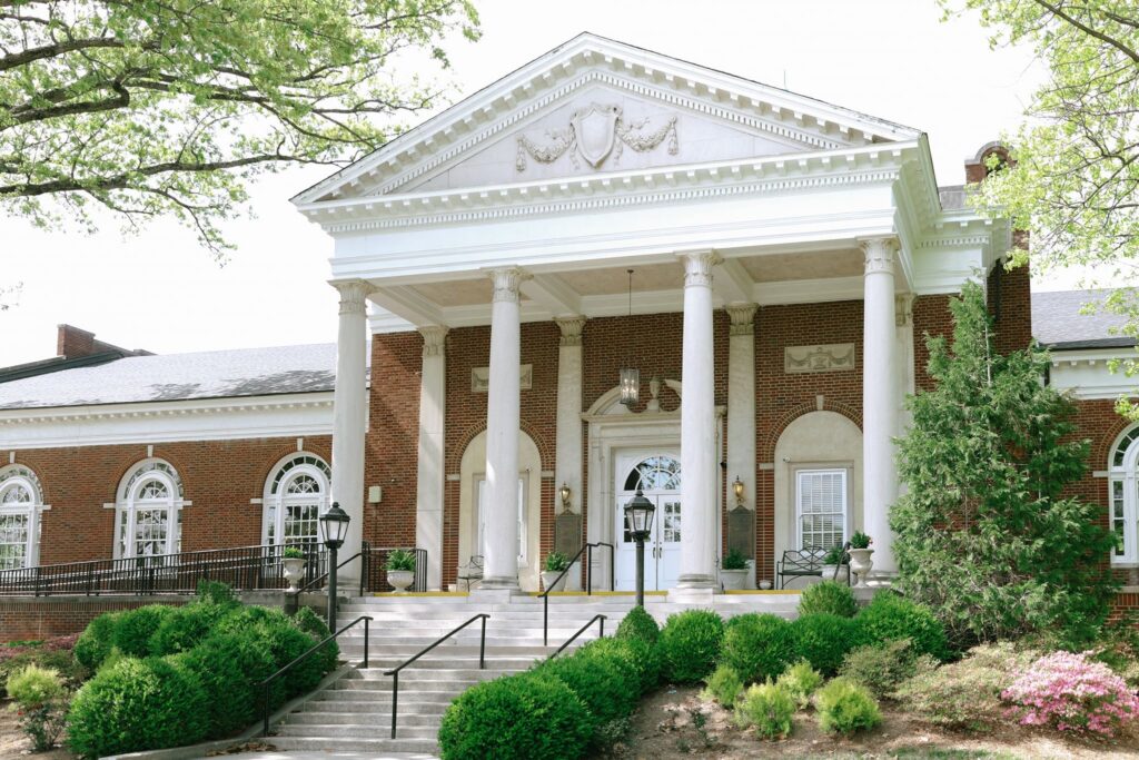 The grand front entrance of The Olmsted showcasing its historic architecture in Louisville, Kentucky.