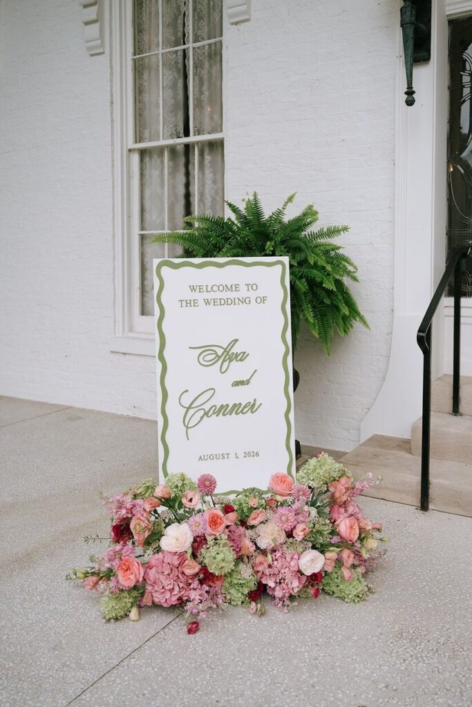 A sign that says "Welcome to the Wedding of Ava & Conner" for the couples reception at Whitehall wedding venue. 